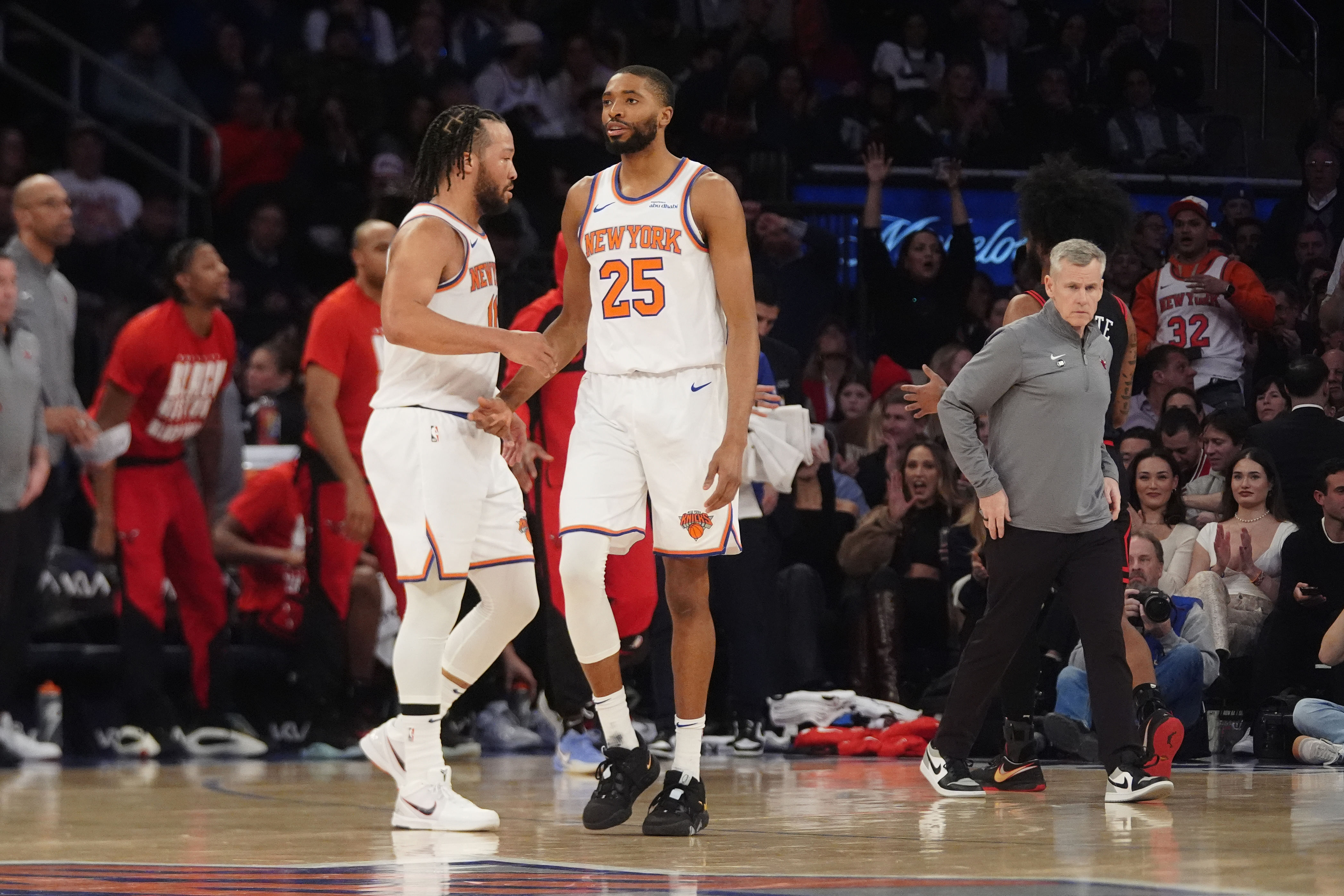 Feb 20, 2025; New York, New York, USA; New York Knicks point guard Jalen Brunson (11) slaps hands with forward Mikal Bridges (25) after he made a play against the Chicago Bulls during the first half at Madison Square Garden. Mandatory Credit: Gregory Fisher-Imagn Images - Source: Imagn